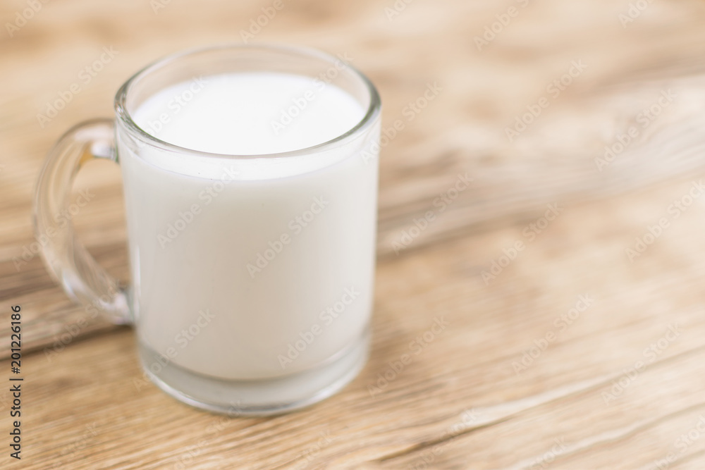 Glass kefir (milk) on a wooden background. The concept of diet, weight loss. Glass kefir (milk) on a wooden background. The concept of diet, weight loss.