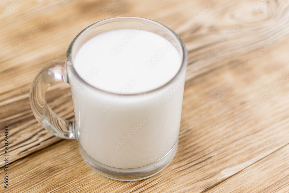 Glass kefir (milk) on a wooden background. The concept of diet, weight loss. Glass kefir (milk) on a wooden background. The concept of diet, weight loss.
