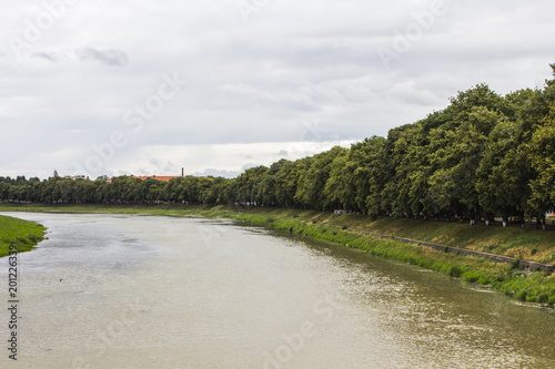 Fototapeta Naklejka Na Ścianę i Meble -  View of the river Uzh in the cloudy weather. Uzhhorod. Ukraine