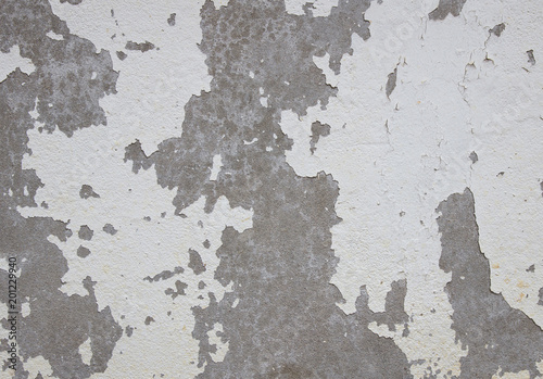 old cracked paint on the concrete wall © aopsan