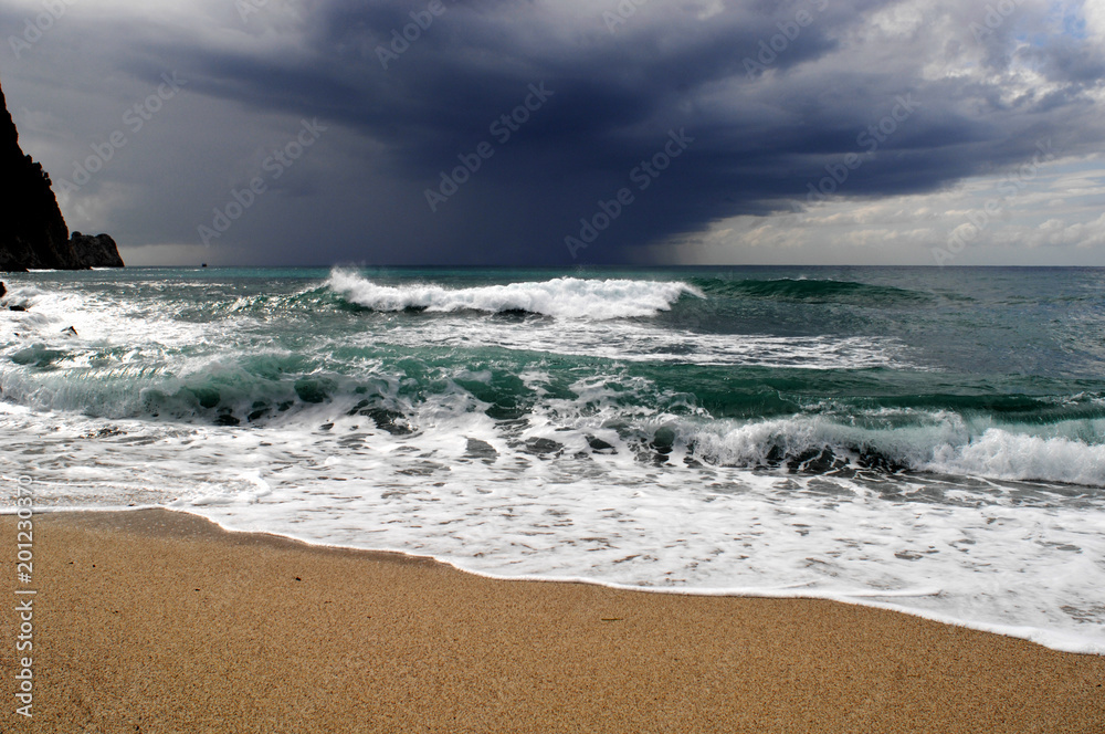 Big waves crushing on curved stone, on stormy weather, big tide. Alanya, Turkey. Big waves crushing on curved stone, on stormy weather, big tide. Alanya, Turkey.