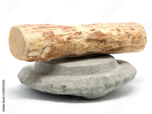 Thanaka wood and Kyauk pyin stone slab on white background (Isolated background). The Tanaka is popular with Burmese women. The face to make a beautiful white face.