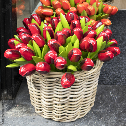 the Souvenirs at Bloemenmarkt - floating flower market on Singel Canal. Amsterdam. Netherlands photo