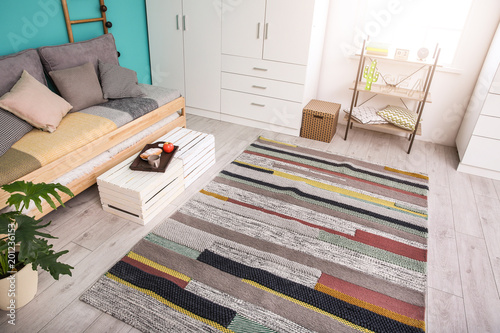 Fotografie Modern living room interior with stylish sofa and carpet