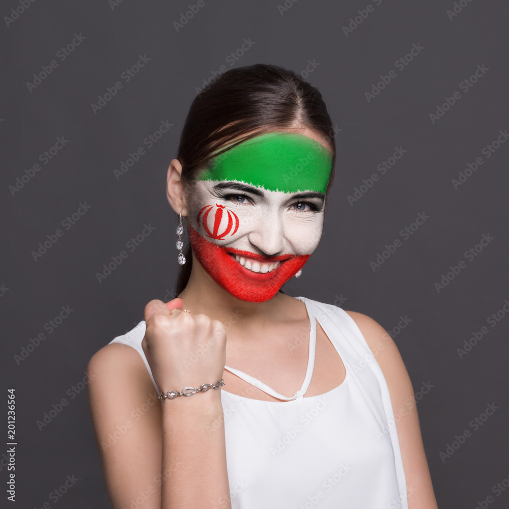 Young woman with Iran flag painted on her face Young woman with Iran flag painted on her face