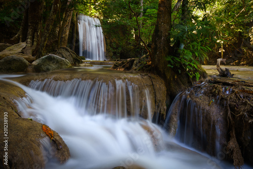 Fototapeta Naklejka Na Ścianę i Meble -  The beauty of limestone waterfall is popular with tourists. And famous of Thailand. In Erawan Waterfall National Park Kanchanaburi