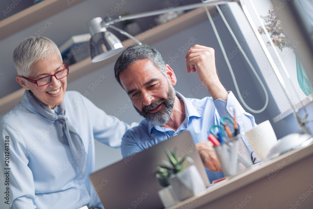 Two people talking in the office Two people talking in the office