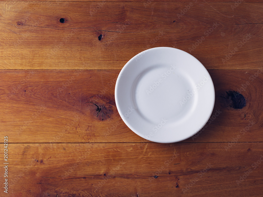 Empty Plate on wooden background Empty Plate on wooden background