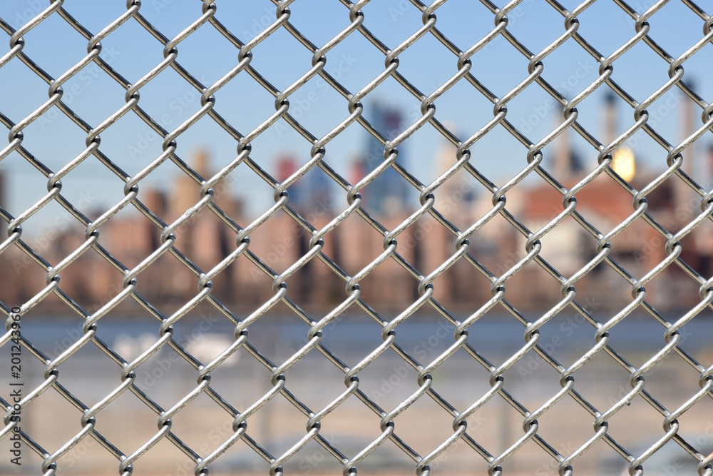 Urban chain link fence closeup abstract texture background. Urban chain link fence closeup abstract texture background.