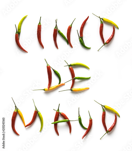 Cinco De Mayo letters from red, green and yellow hot little chili peppers isolated on the white background
