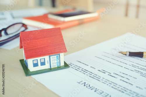 Mortgage contract for sale of contract house with paper and vintage tone.