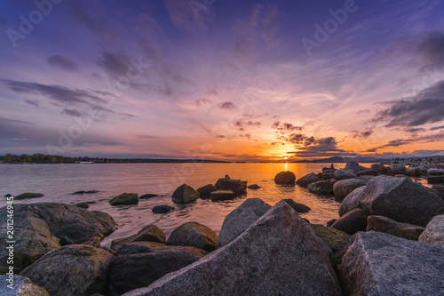 Rocks beach with sunset sky backgrounds