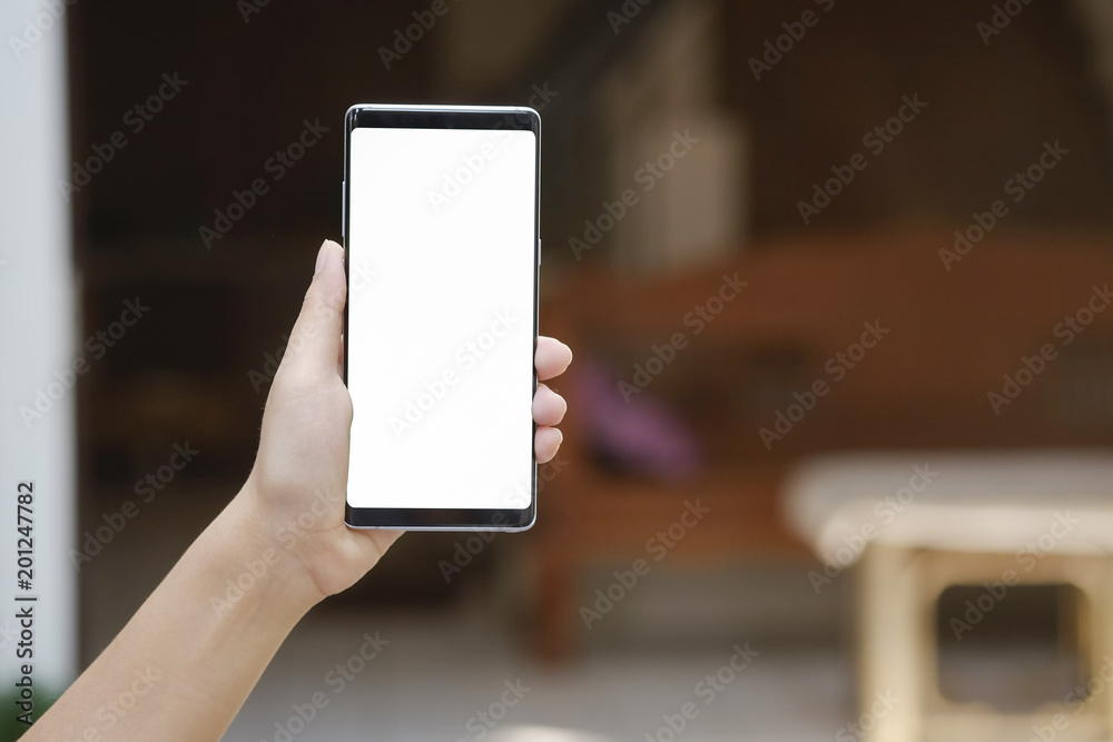Hands showing mockup smartphone mobile with white screen.