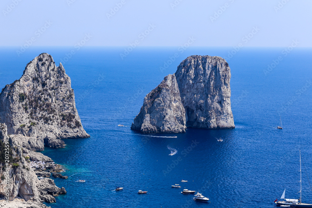 Obraz premium Italy. Capri Island. Faraglioni rock formation seen from Gardens of Augustus