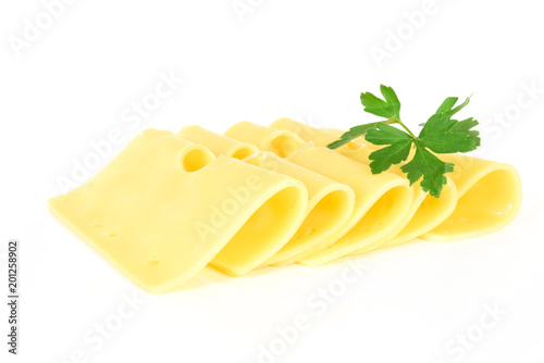 Pieces of fresh yellow cheese with parsley isolated on a white background in close-up