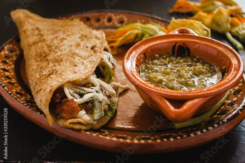 mexican quesadilla with squash blossom, cheese and sauce in mexico city