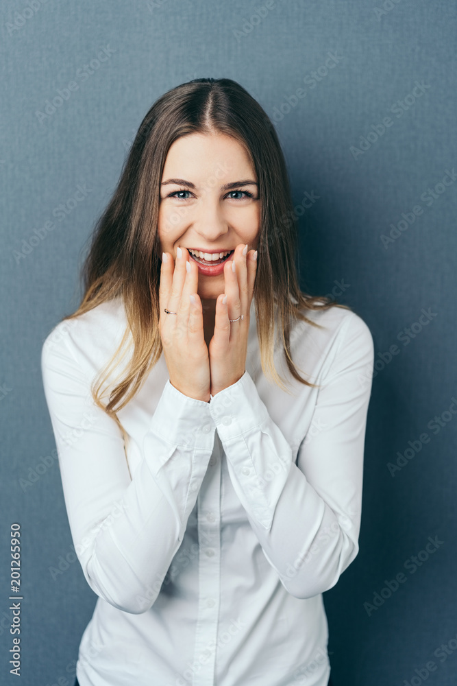 Overjoyed young woman with a beaming smile Overjoyed young woman with a beaming smile