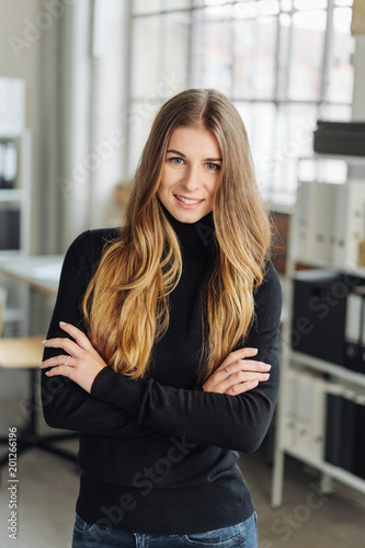Portrait of young cheerful woman in office room Free Download Portrait of young cheerful woman in office room - GFXLoad