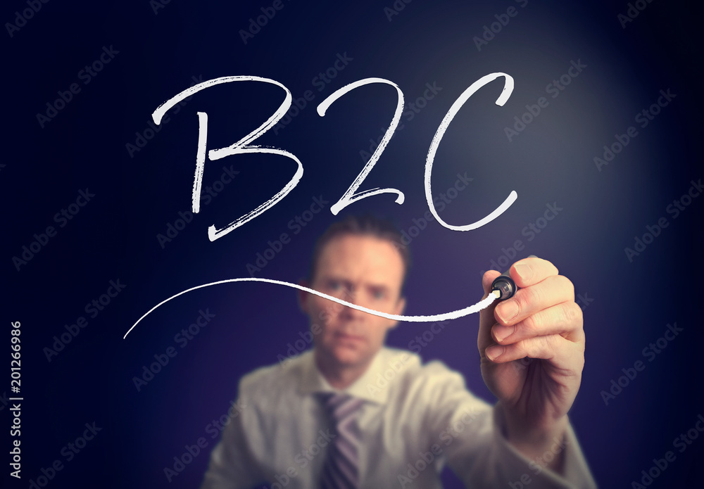 A businessman writing a B2C concept with a white pen on a clear screen. A businessman writing a B2C concept with a white pen on a clear screen.