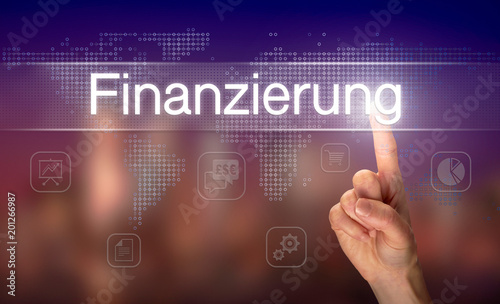 A businessman pressing a Financing "Finanzierung" button in German on a futuristic computer display