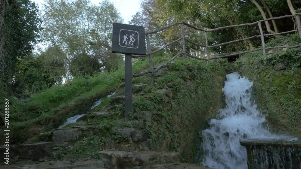 Two springs flowing and a 'no hiking' sign