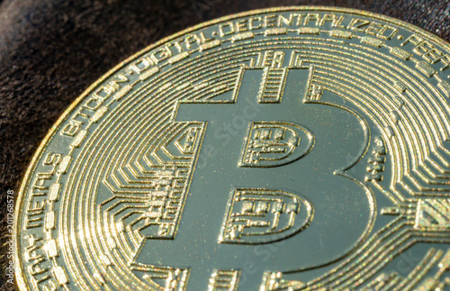 macro of a golden bitcoin coin