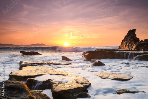 amazing sunset landscape at rocky beach