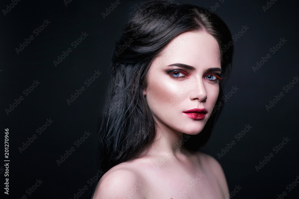 Beautiful portraits with a girl with make up and dark hair in studio Beautiful portraits with a girl with make up and dark hair in studio