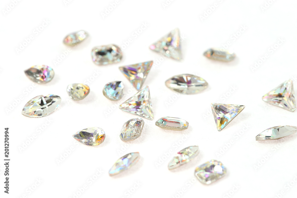 Many scattered rhinestones. On a white background Many scattered rhinestones. On a white background