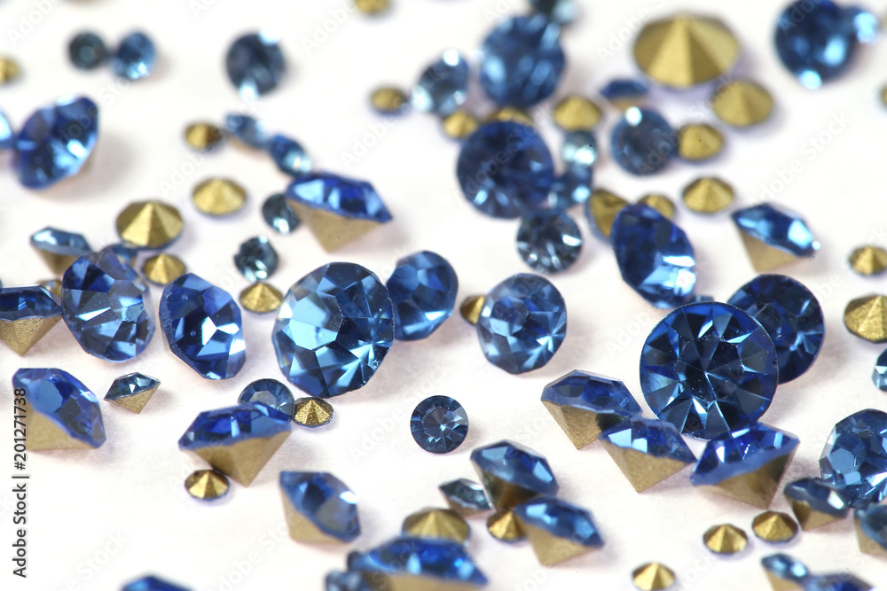 Many scattered rhinestones. On a white background Many scattered rhinestones. On a white background