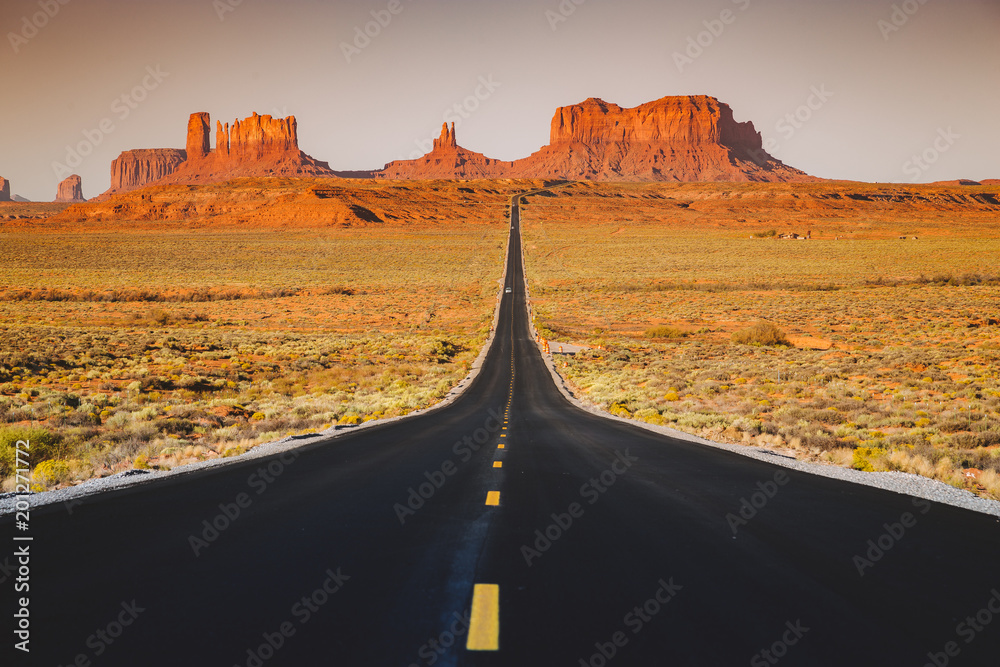 Classic highway view in Monument Valley at sunset, USA