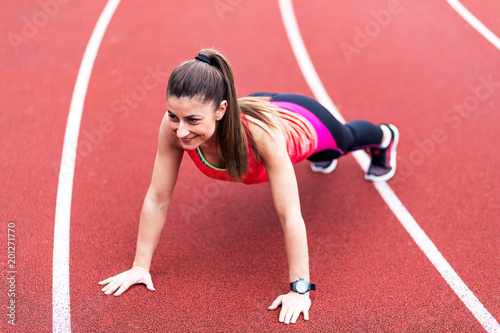 Young Sporty Woman Doing Push Ups