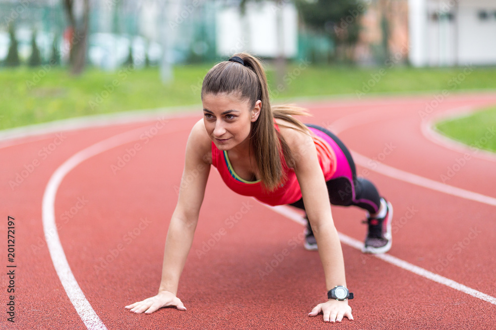 Young Sporty Woman Doing Push Ups Young Sporty Woman Doing Push Ups