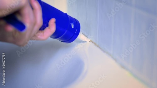 caulking old bathtub 