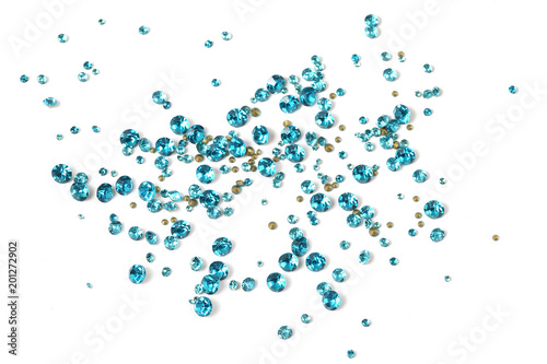 Many scattered rhinestones. On a white background photo