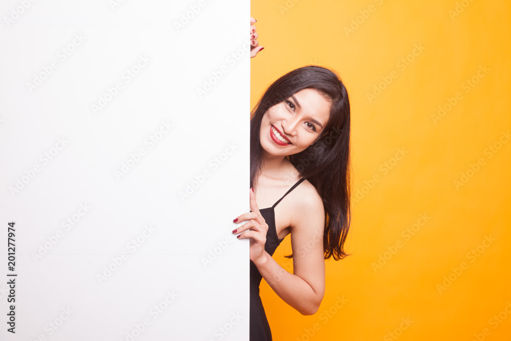 Young Asian woman with blank sign.