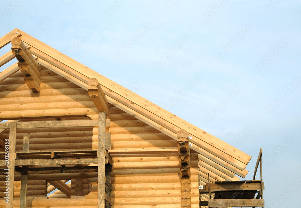 Process of wooden house straight roof slope mounting. Wooden country house construction Process of wooden house straight roof slope mounting. Wooden country house construction