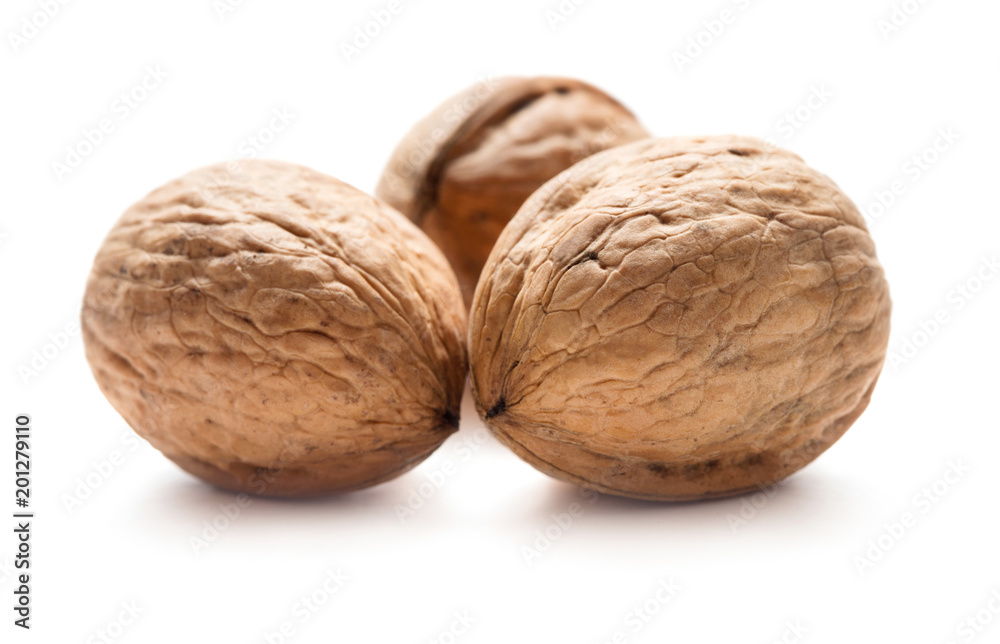 three ripe walnuts isolated on white background three ripe walnuts isolated on white background