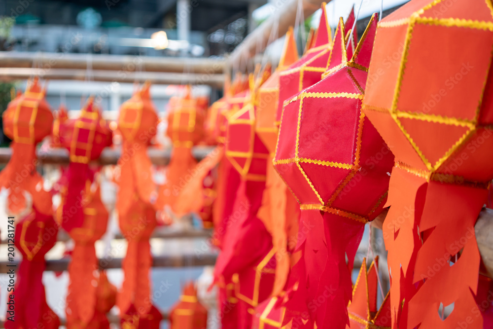 Naklejka premium Thai Paper Lanterns or lamps at a party or festival hanging on wooden structure.