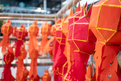 Thai Paper Lanterns or lamps at a party or festival hanging on wooden structure.