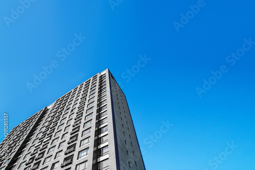 new apartment building on a blue sky background