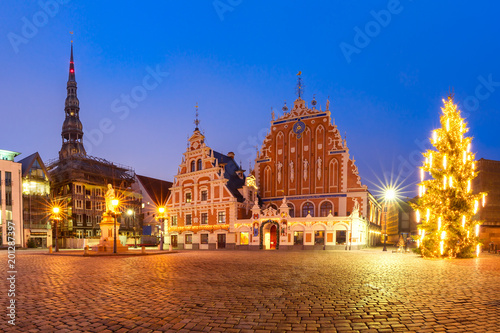 City Hall Square with House of the Blackheads, illuminated Christmas tree and Saint Roland Statue in Old Town of Riga at night, Latvia