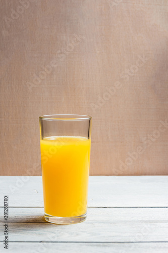 Sliced Orange and Juice Drink on White Wooden Background. Healthy Concept with Copyspace.