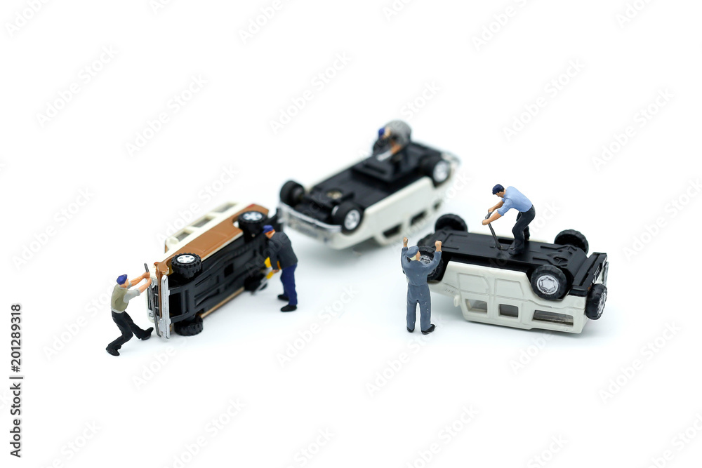 Miniature people : Technician auto mechanic with a wrench working in garage,Car repairing ,Repair service Miniature people : Technician auto mechanic with a wrench working in garage,Car repairing ,Repair service