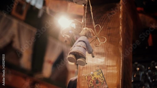 An old doll hanging on a rope