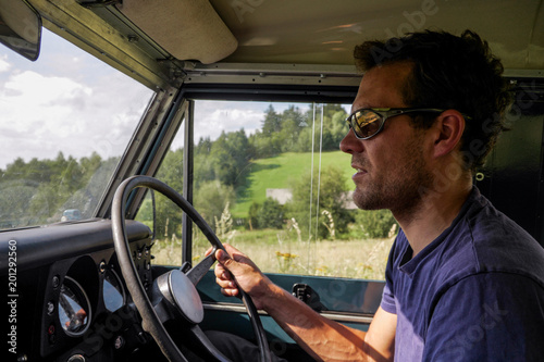 caucasian man driving a off road jeep © listercz