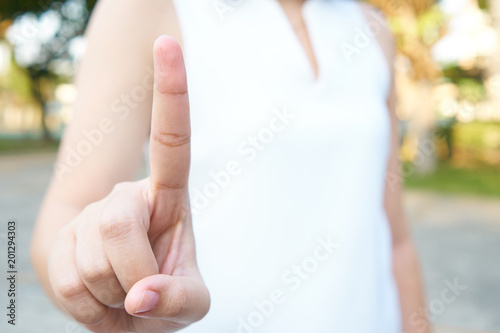 Asian white-haired business woman, aged 25-35 years, wearing a white suit with a finger, scanned using a finger to scan. using as background business concept and Technology concept with copy space.