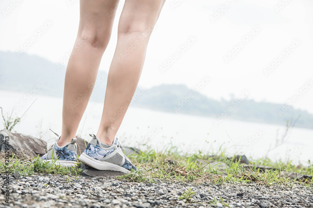 Portrait of young woman resting after running