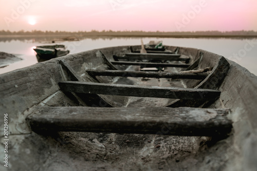 Fishing boat parking on the riverside evening clouds on sunset  Roi Et  Thailand