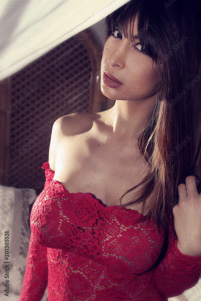 Jeune femme sexy portant un body transparent rouge Stock Photo | Adobe Stock